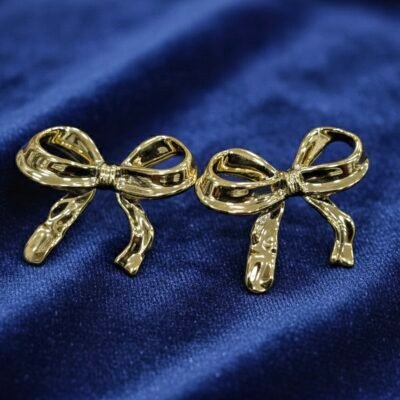 Golden trending crushed bow earring korean earring